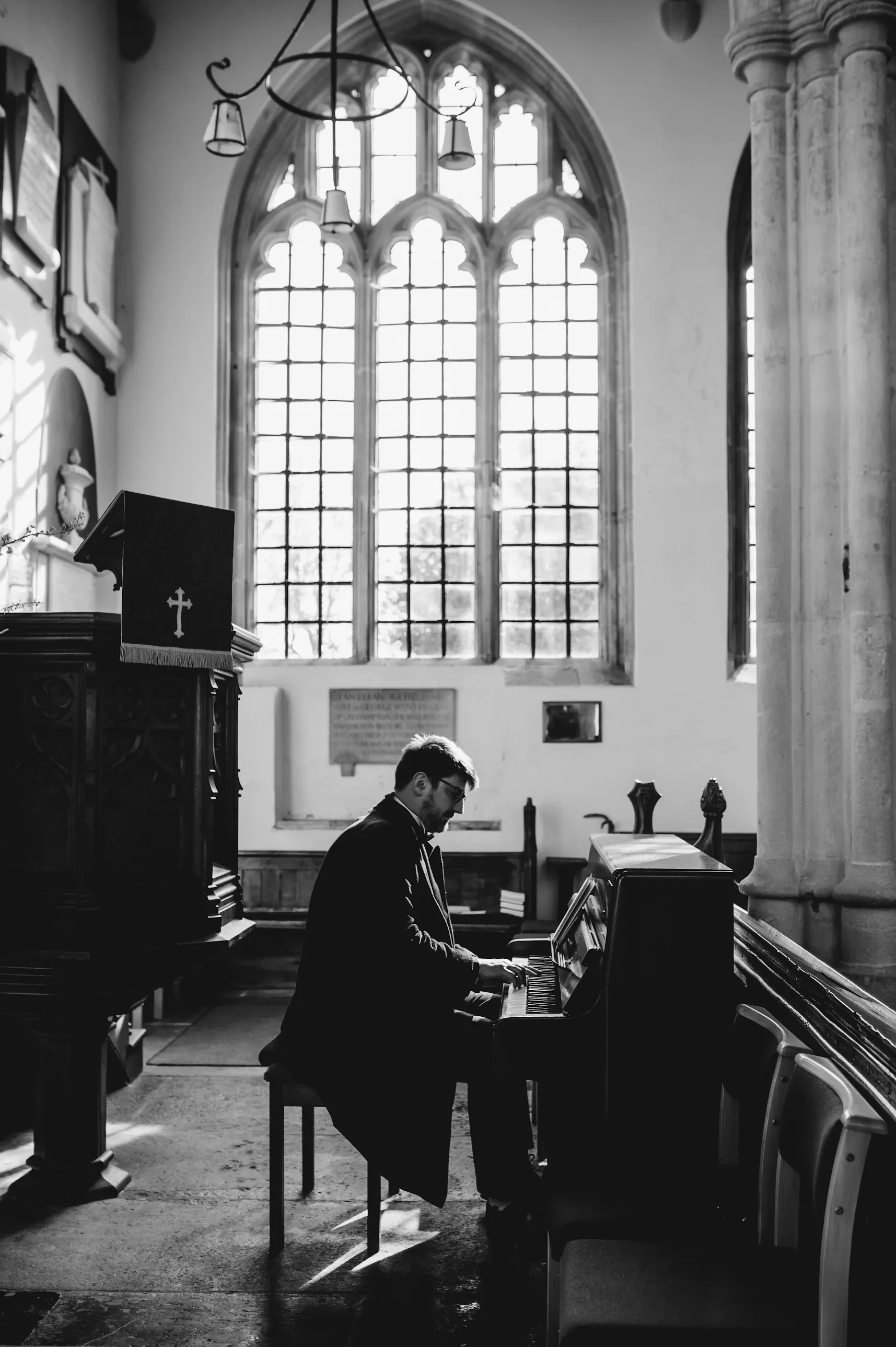 Jools Scott playing piano in a historic church